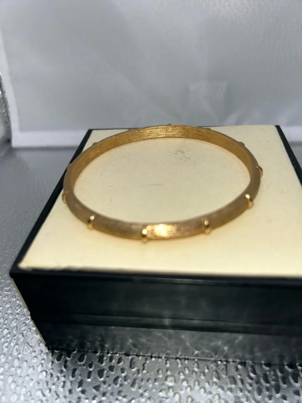 Vintage trifari bangle sleek gold tone brushed texture raised accents classic